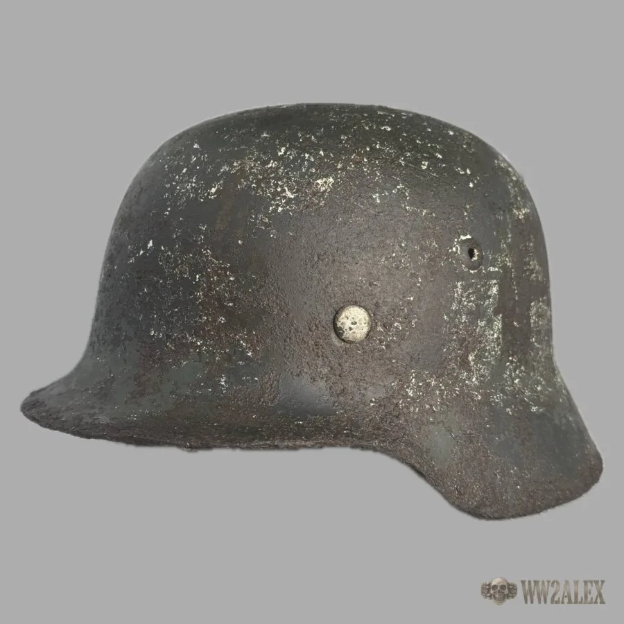 Original German WW2 M35 helmet, size 64, side view showing the rolled edge and the separate vent grommet