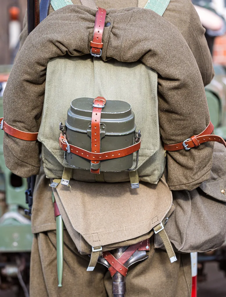 Reenactor in German infantry field kit seen from behind: mess tin, shelter quarter, bread bag