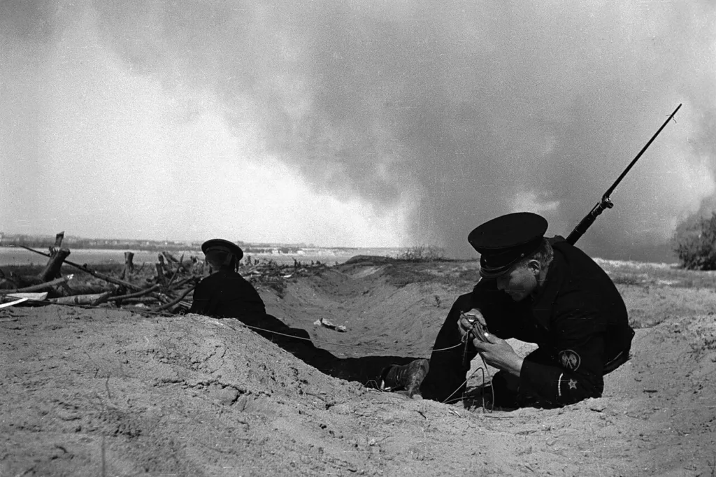 Soviet sailor restoring a communication line in Stalingrad