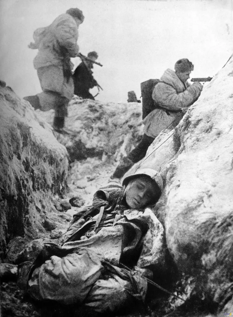 Soviet soldiers leaving a trench to attack on the Leningrad front, December 1943